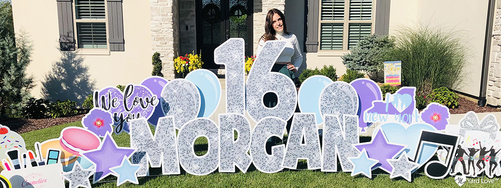 16 Morgan yard sign with girl smiling behind