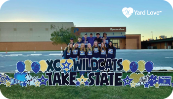 yard love sign XC Wildcats Take State in black letters with gold and blue balloons and emojis and the cross country team in the background
