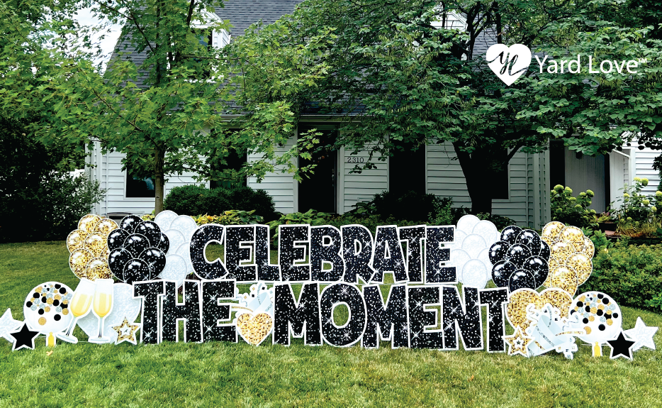 Celebrate the Moment yard signs in white, gold, and black
