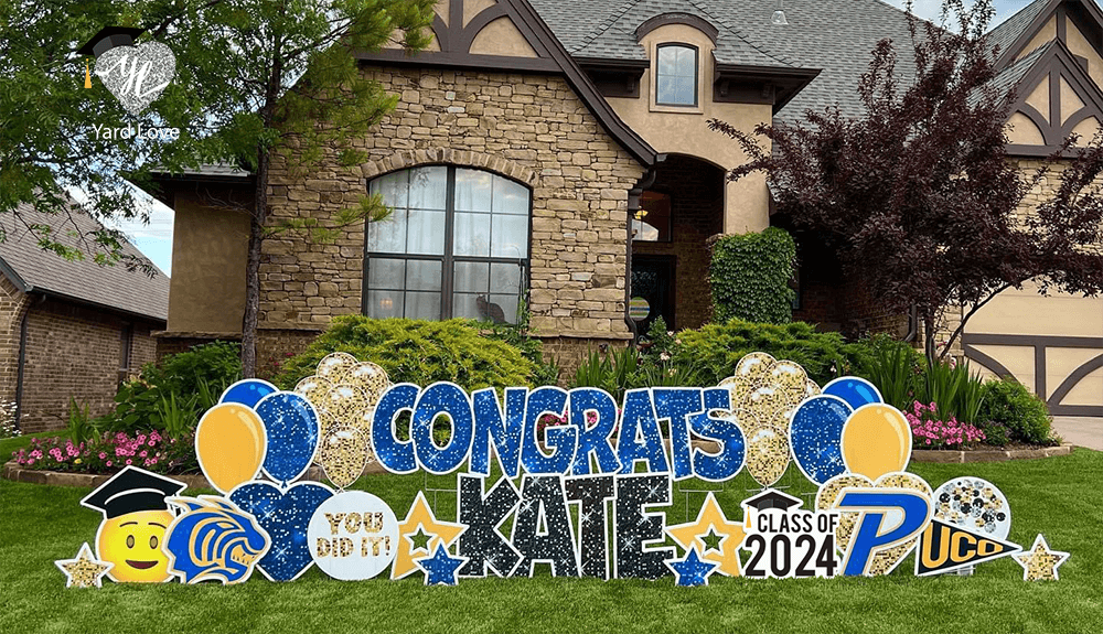 Image of a Yard Love sign in blue and black that says "Congrats Kate" with yellow, and gold added Signs - Class of 2024, Balloons, Hearts, stars, UCO, High School Mascot, You Did It,, We Love You, Happy Face Emoji with grad cap Flowers, Mascat Paw, grad cap