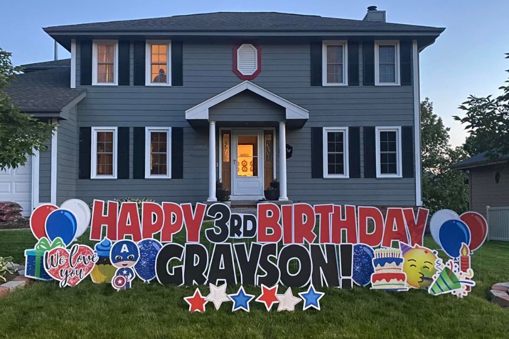 Happy 3rd Birthday Grayson Yard Sign in Red and Black with accessory signs: Balloons, stars, "we love you" present, candle, celebrate, cake, cupcake, and superhero.