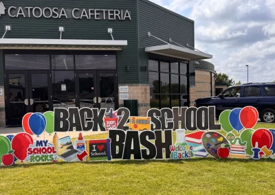 YL Broken Arrow sign in front of "Catoosa Cafeteria" - "Back 2 School Bash". Fun, colorful school symbolism and balloons