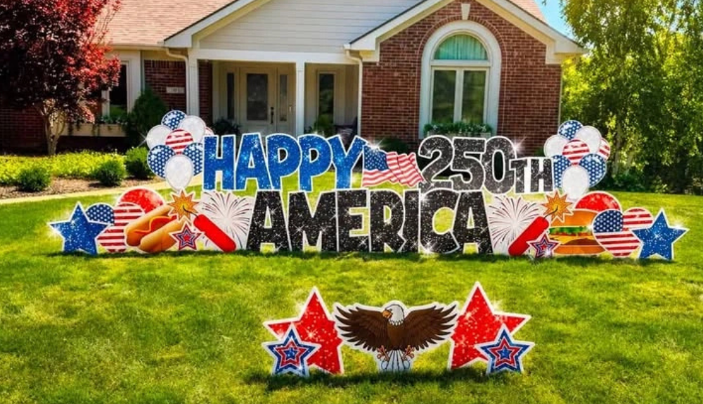 yard love sign Thank You Veterans! in black letters with red white and blue balloons and stars